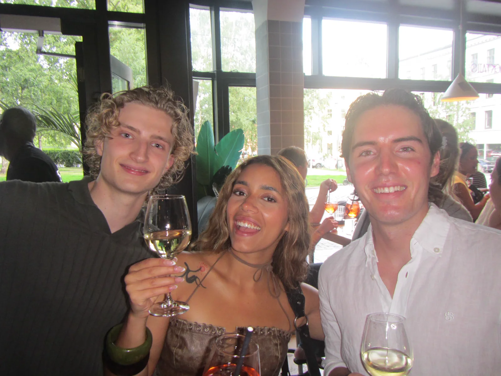 Three friends sharing a drink at the start of the crawl